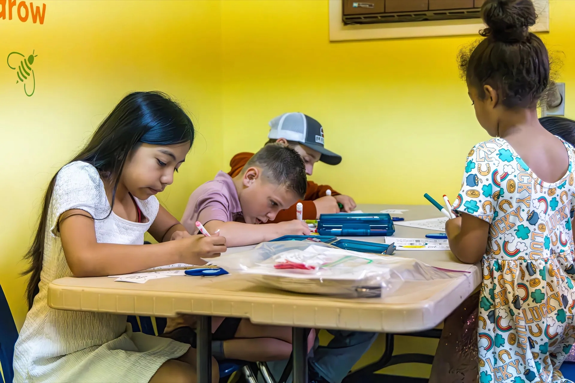 Children completing an activity together in a Crossing Kids classroom