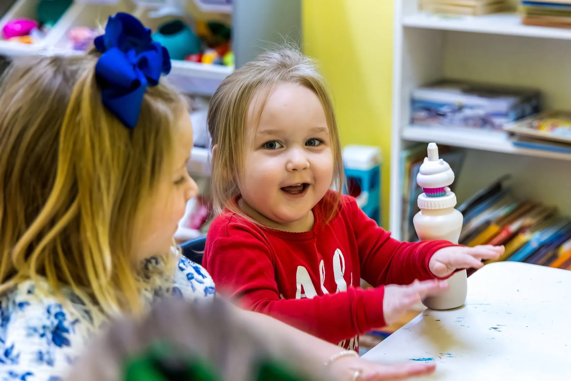 A toddler enjoying an activity in the nursery