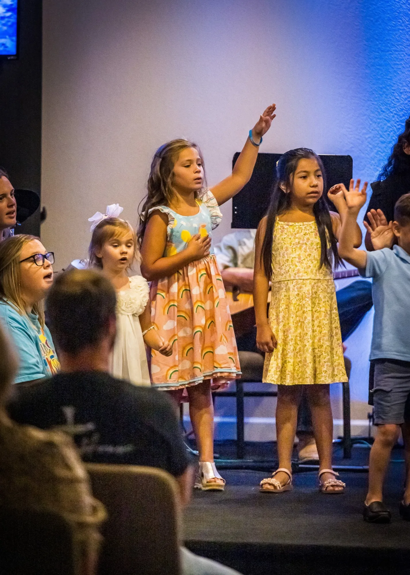 Children worshiping during a Sunday service