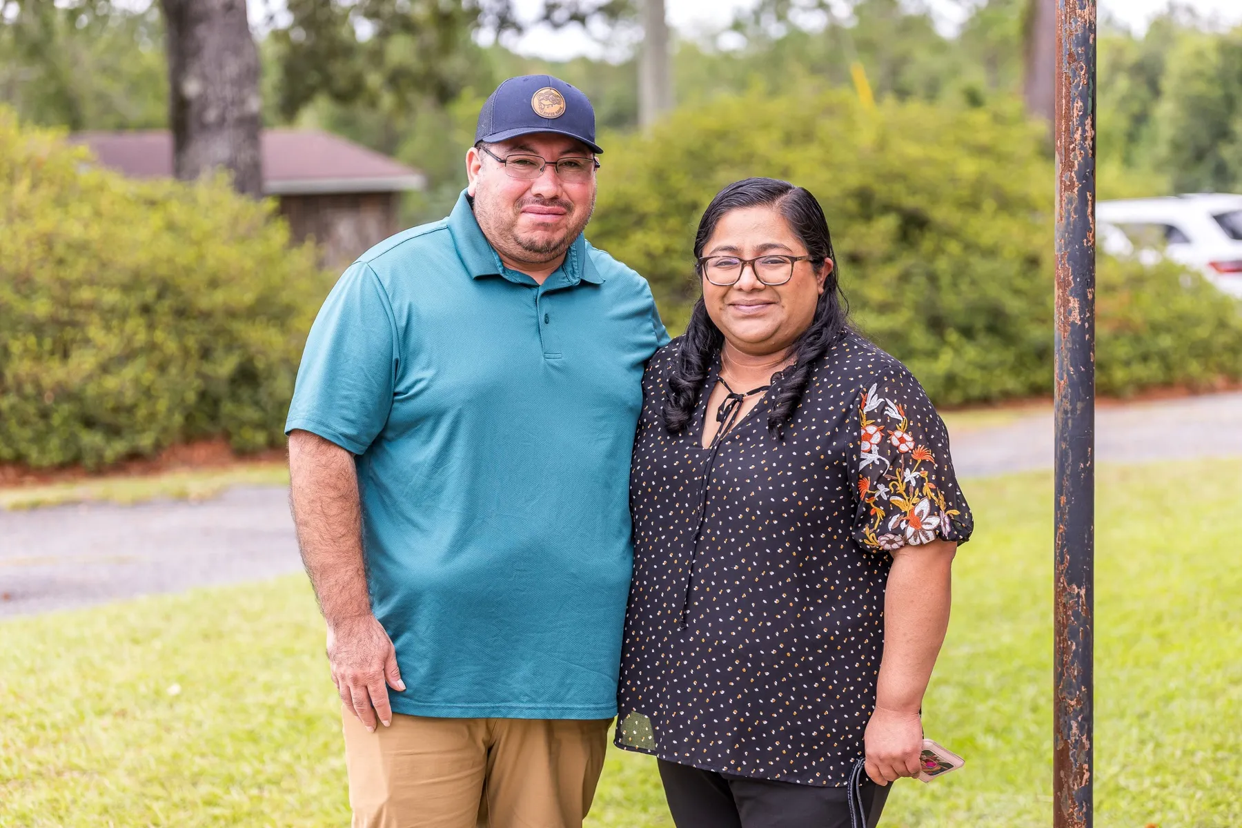 A couple standing together outside Cedar Crossing Church