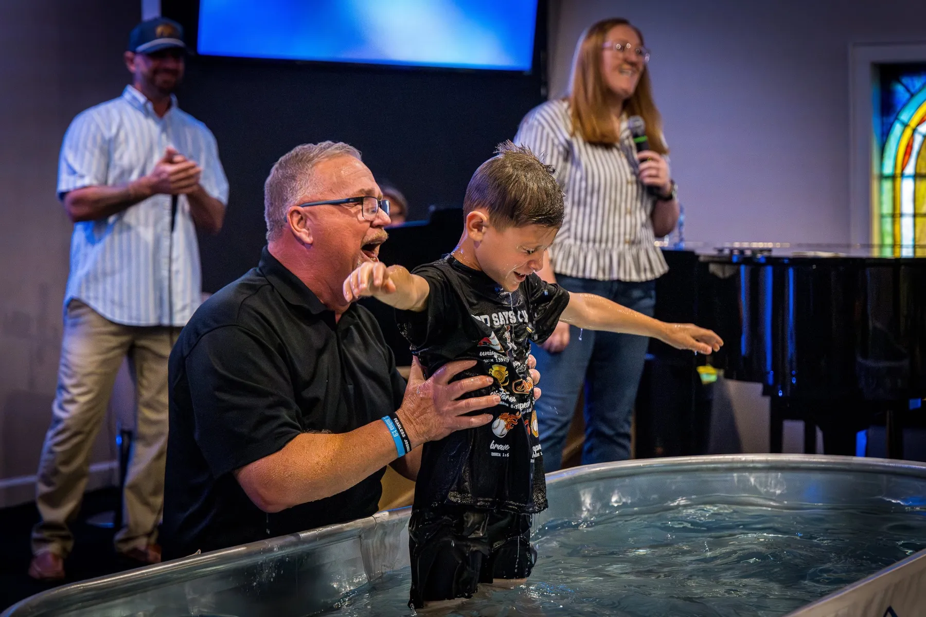 A child celebrating baptism at Cedar Crossing Church