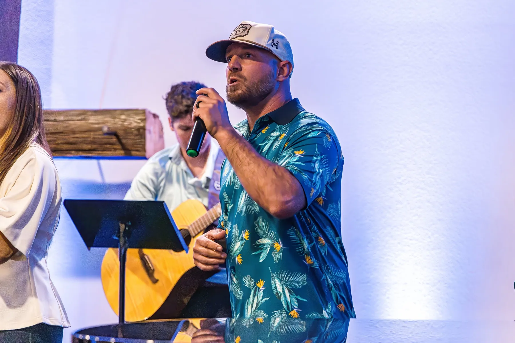 A worship leader singing at Cedar Crossing Church