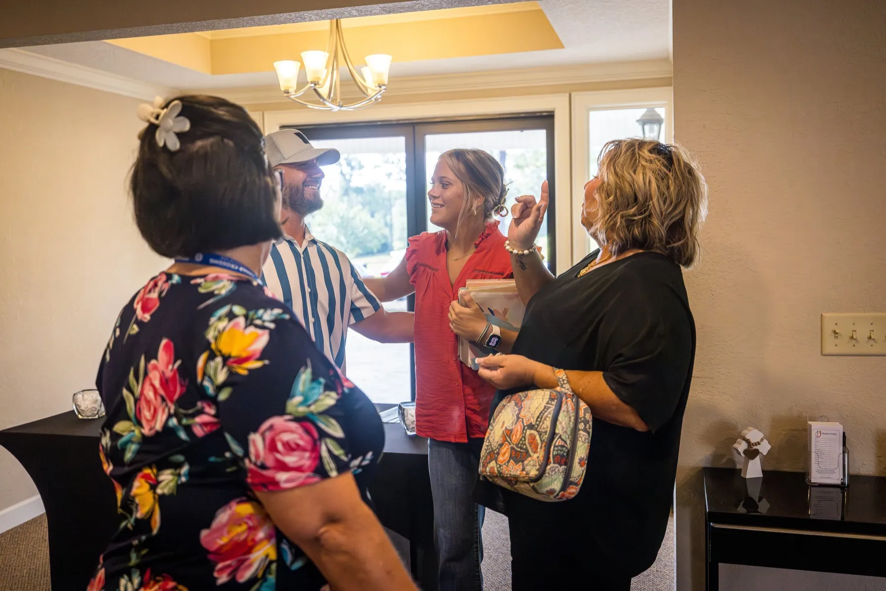 A group of friends gathering in the Cedar Crossing welcome area