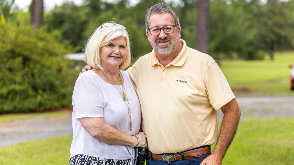A couple standing together outside Cedar Crossing Church
